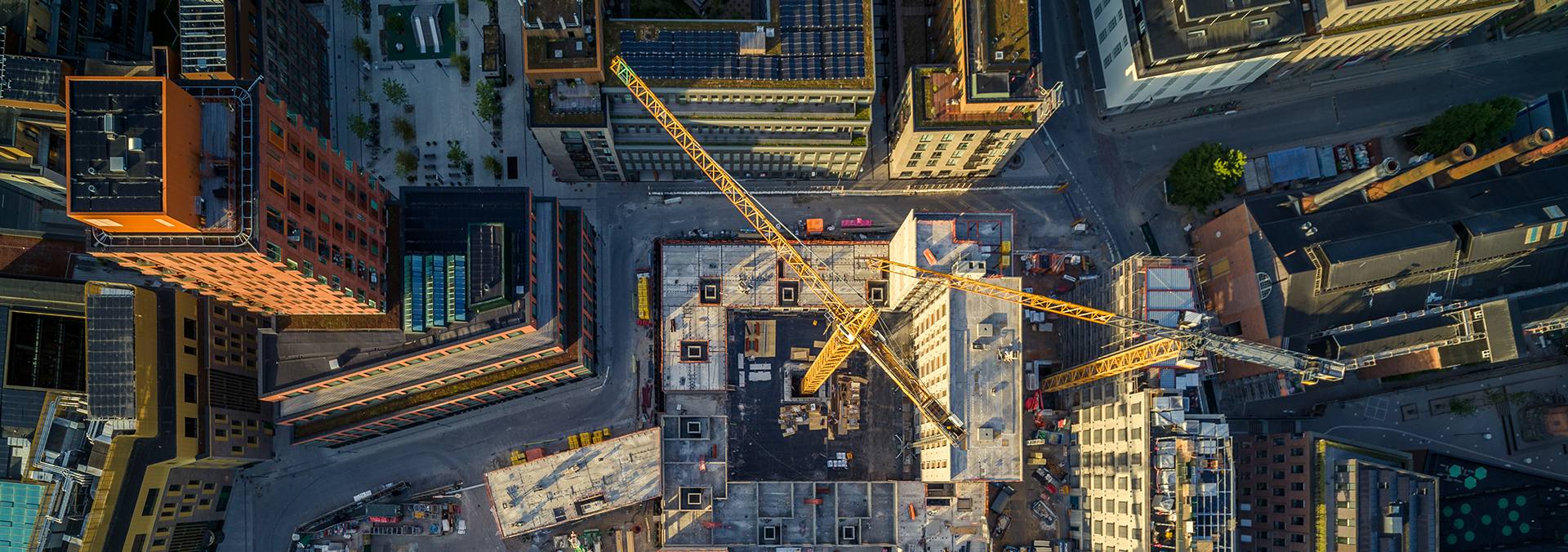 Construction site with cranes viewed from above (PHOTO: DroneRune)